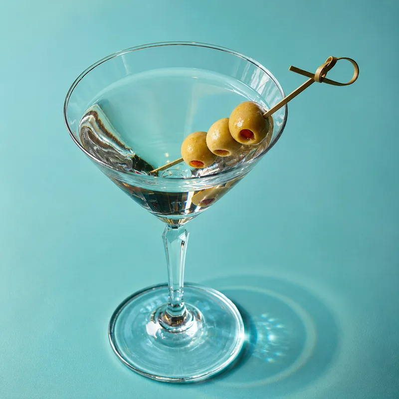 Signature cocktail with olive garnish